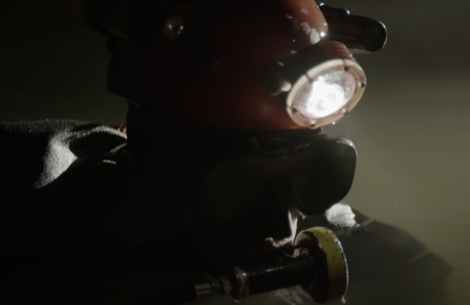 Screenshot of rescue divers in the cave - from Thai Cave Rescue (Drain the Oceans) 2019