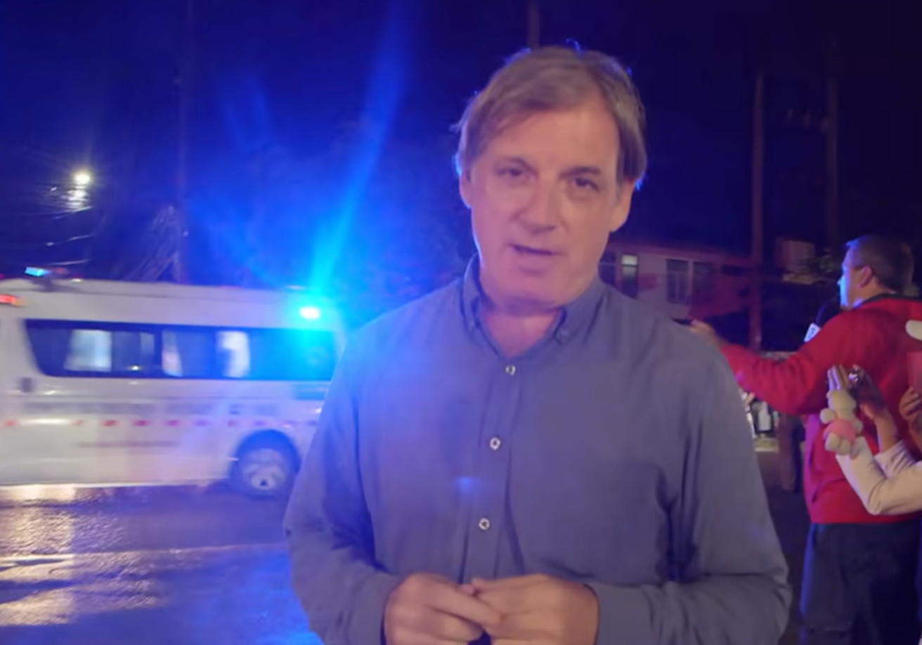 Screenshot of Journalist outside the cave - from Thai Cave Rescue (Drain the Oceans) 2019