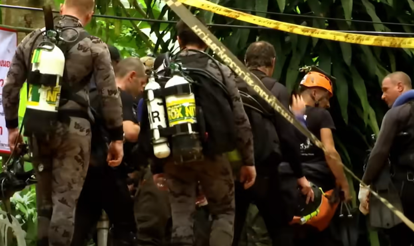 Screenshot of rescue divers in the cave - from Thai Cave Rescue (Drain the Oceans) 2019