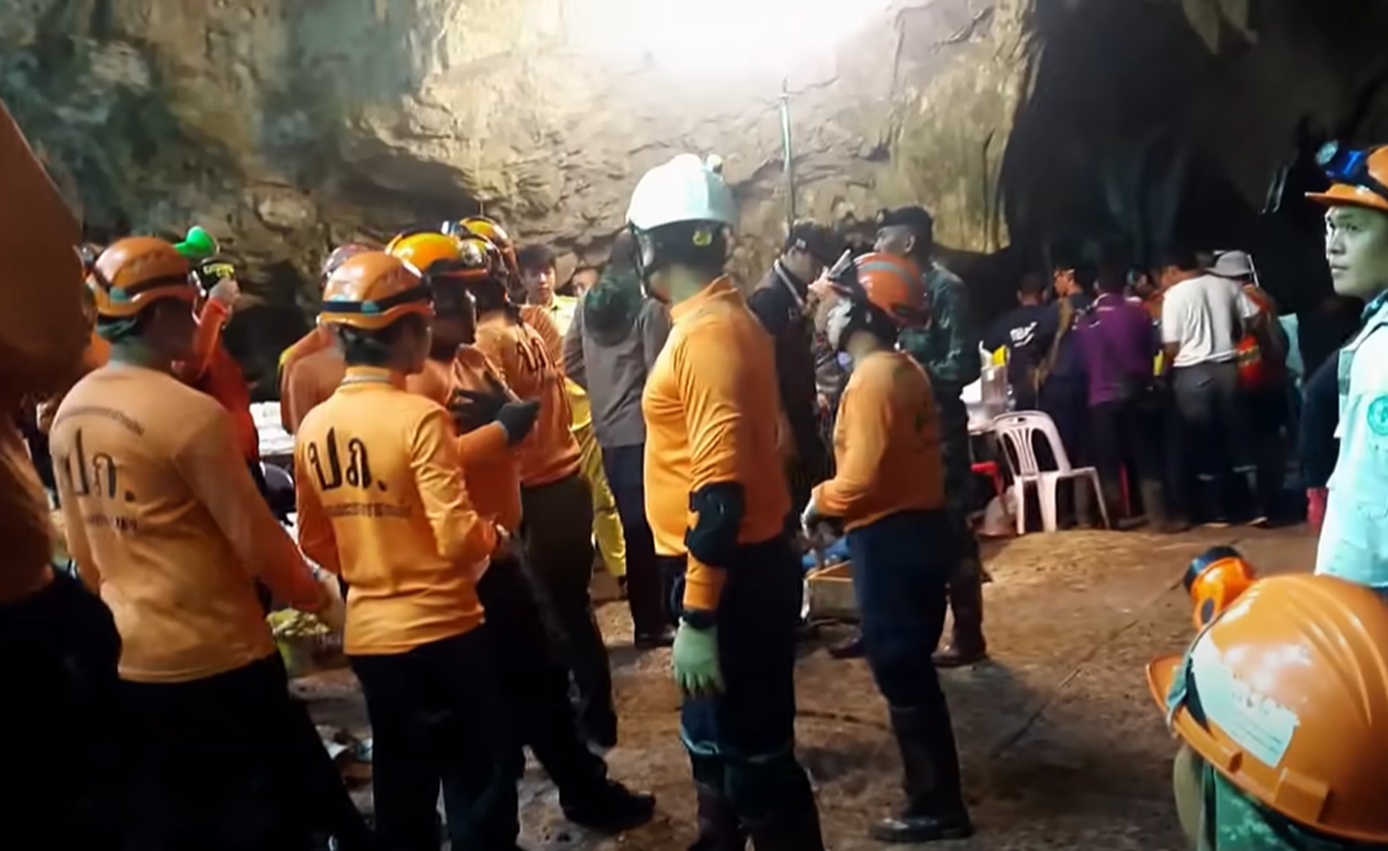 Screenshot of rescue divers in the cave - from Thai Cave Rescue (Drain the Oceans) 2019