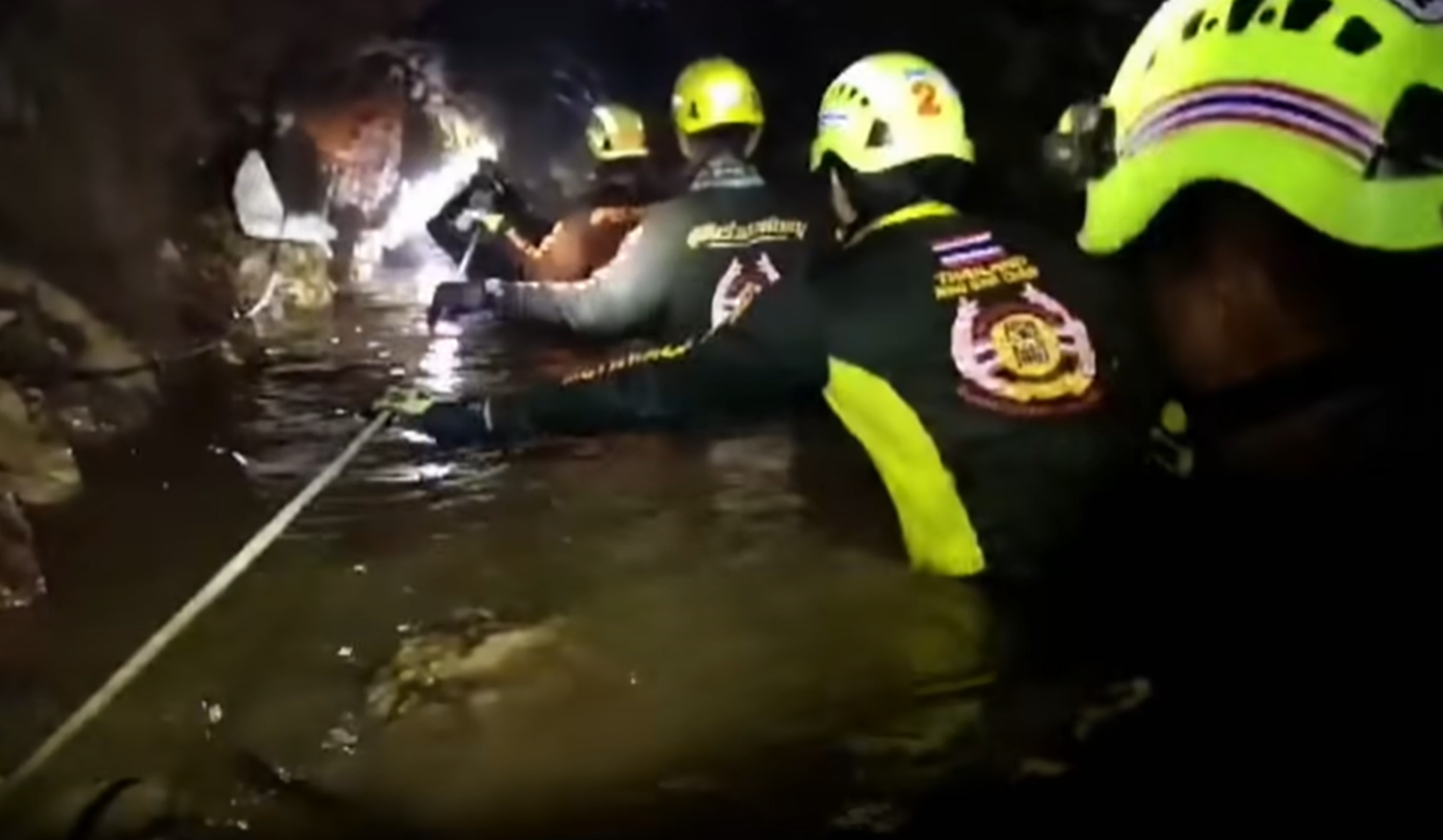 Screenshot of rescue divers in the cave - from Thai Cave Rescue (Drain the Oceans) 2019