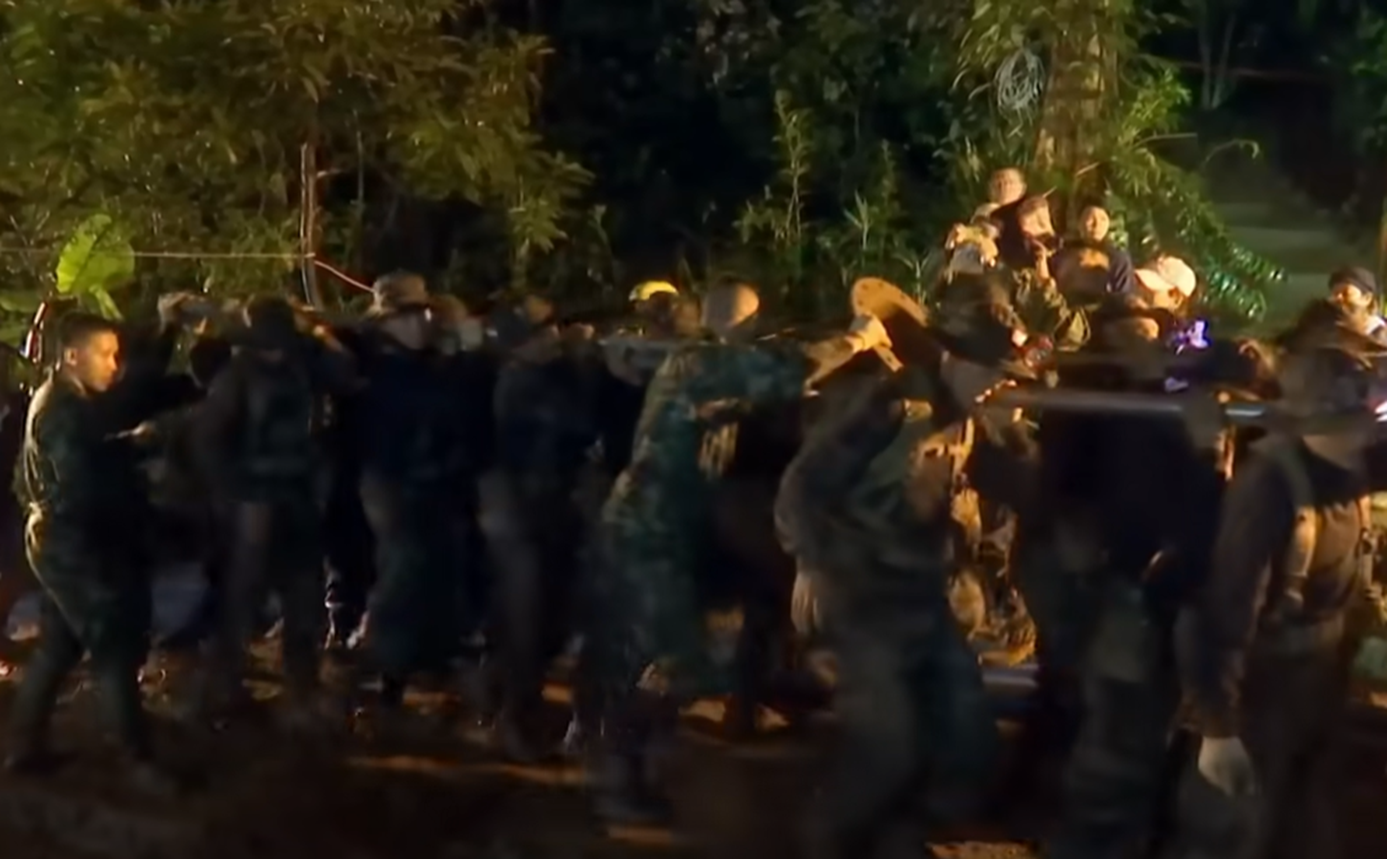 Screenshot of rescue divers in the cave - from Thai Cave Rescue (Drain the Oceans) 2019