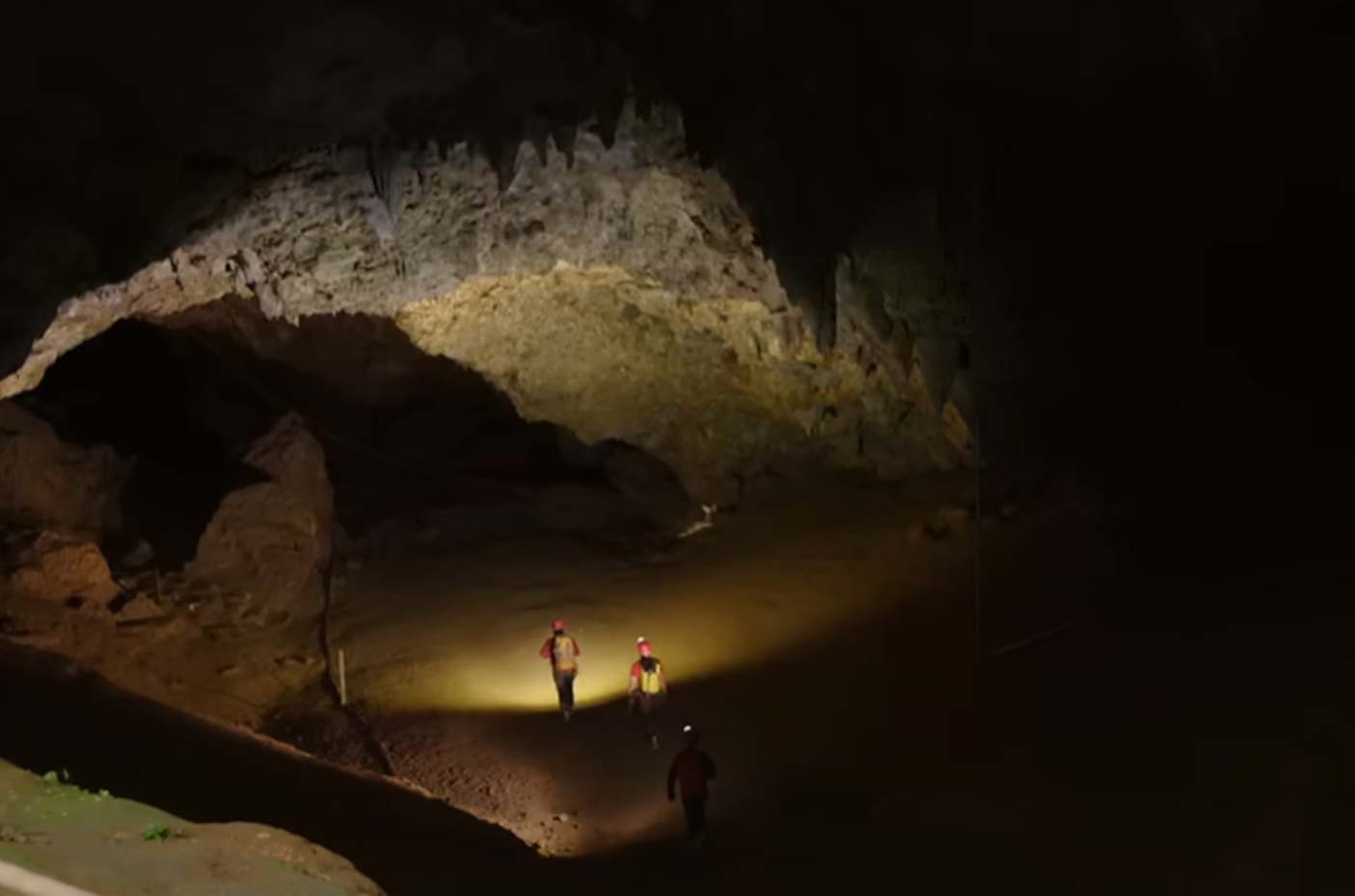 Screenshot of people in the cave - from Thai Cave Rescue (Drain the Oceans) 2019