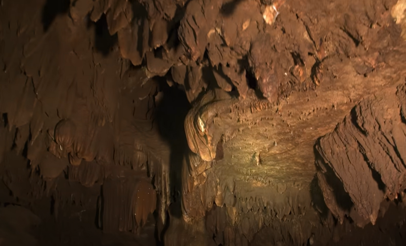 Screenshot of dark inside of the cave - from Thai Cave Rescue (Drain the Oceans) 2019
