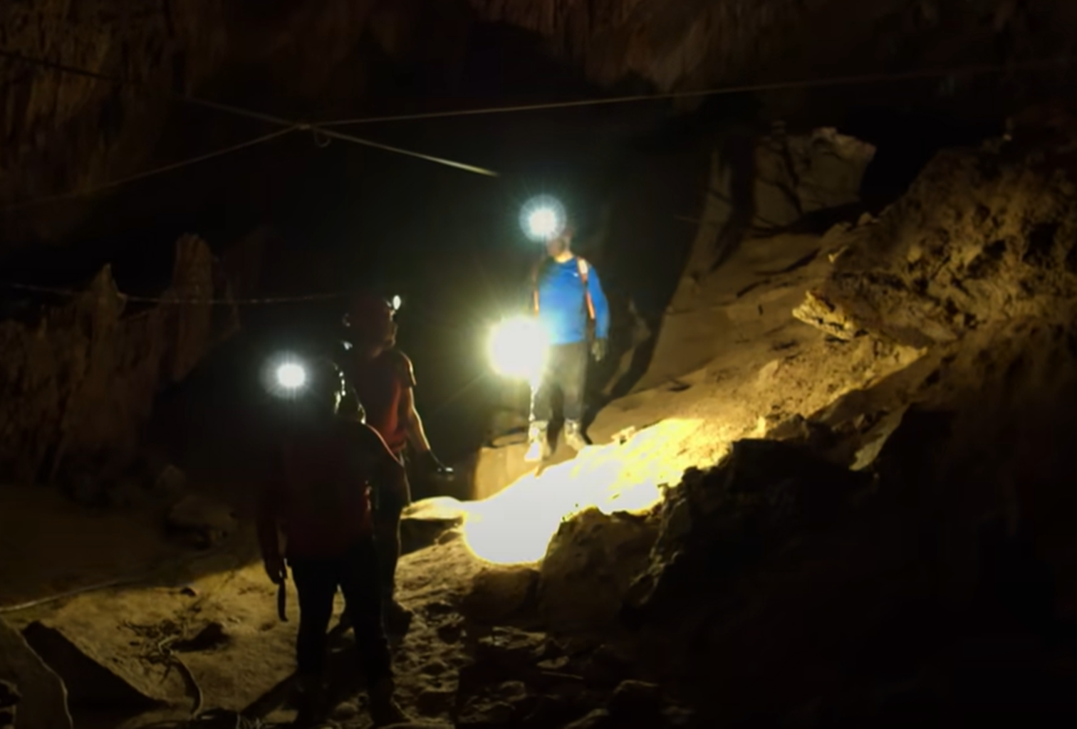 Screenshot of rescue divers in the cave - from Thai Cave Rescue (Drain the Oceans) 2019