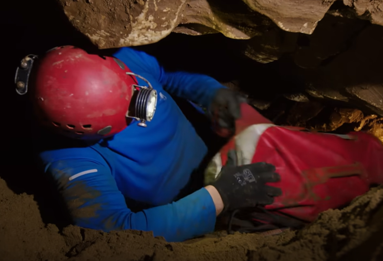 Screenshot of rescue divers in the cave - from Thai Cave Rescue (Drain the Oceans) 2019