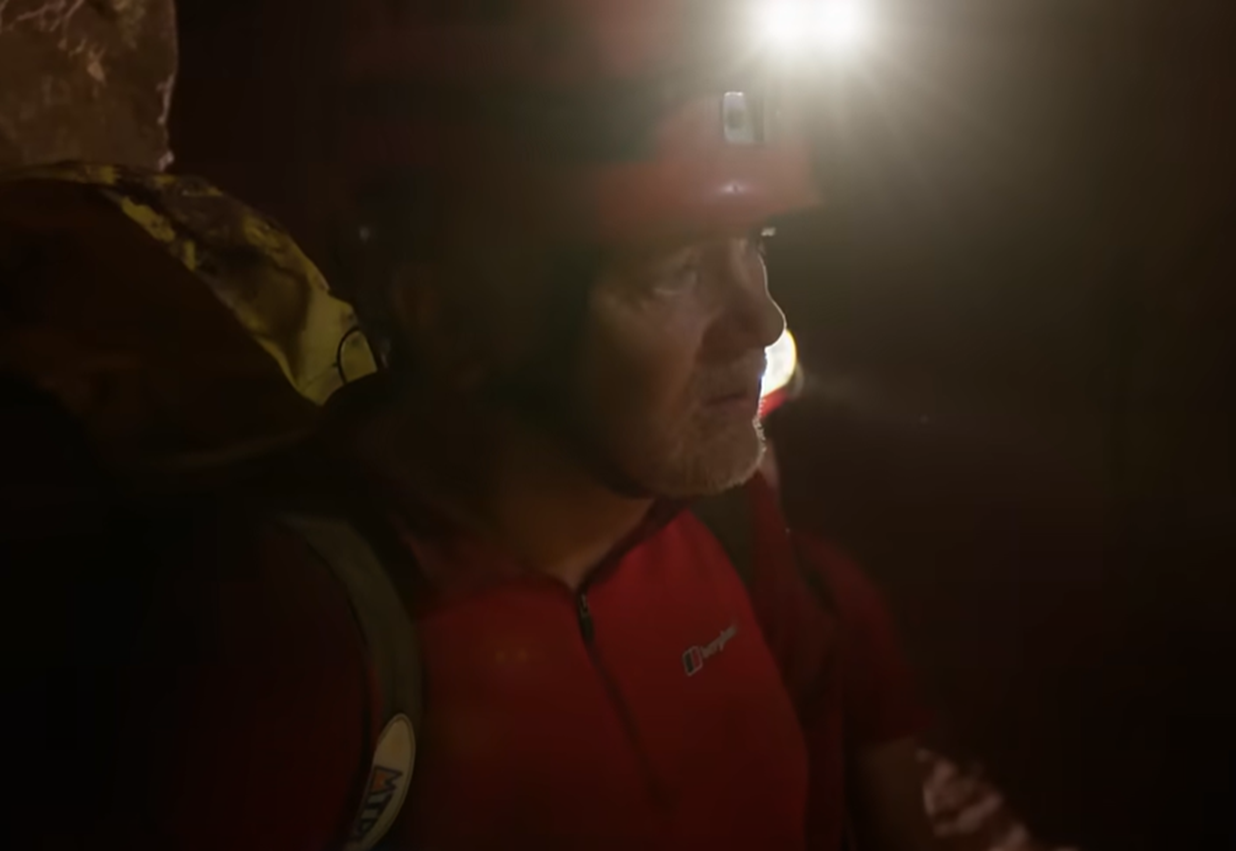 Screenshot of rescue divers in the cave - from Thai Cave Rescue (Drain the Oceans) 2019