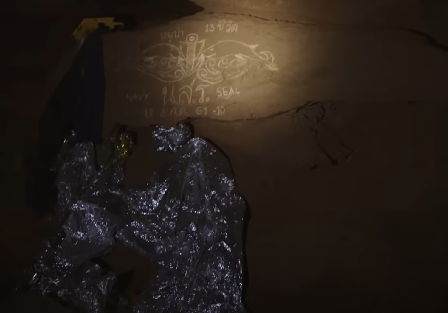 Screenshot of dark inside of the cave - from Thai Cave Rescue (Drain the Oceans) 2019