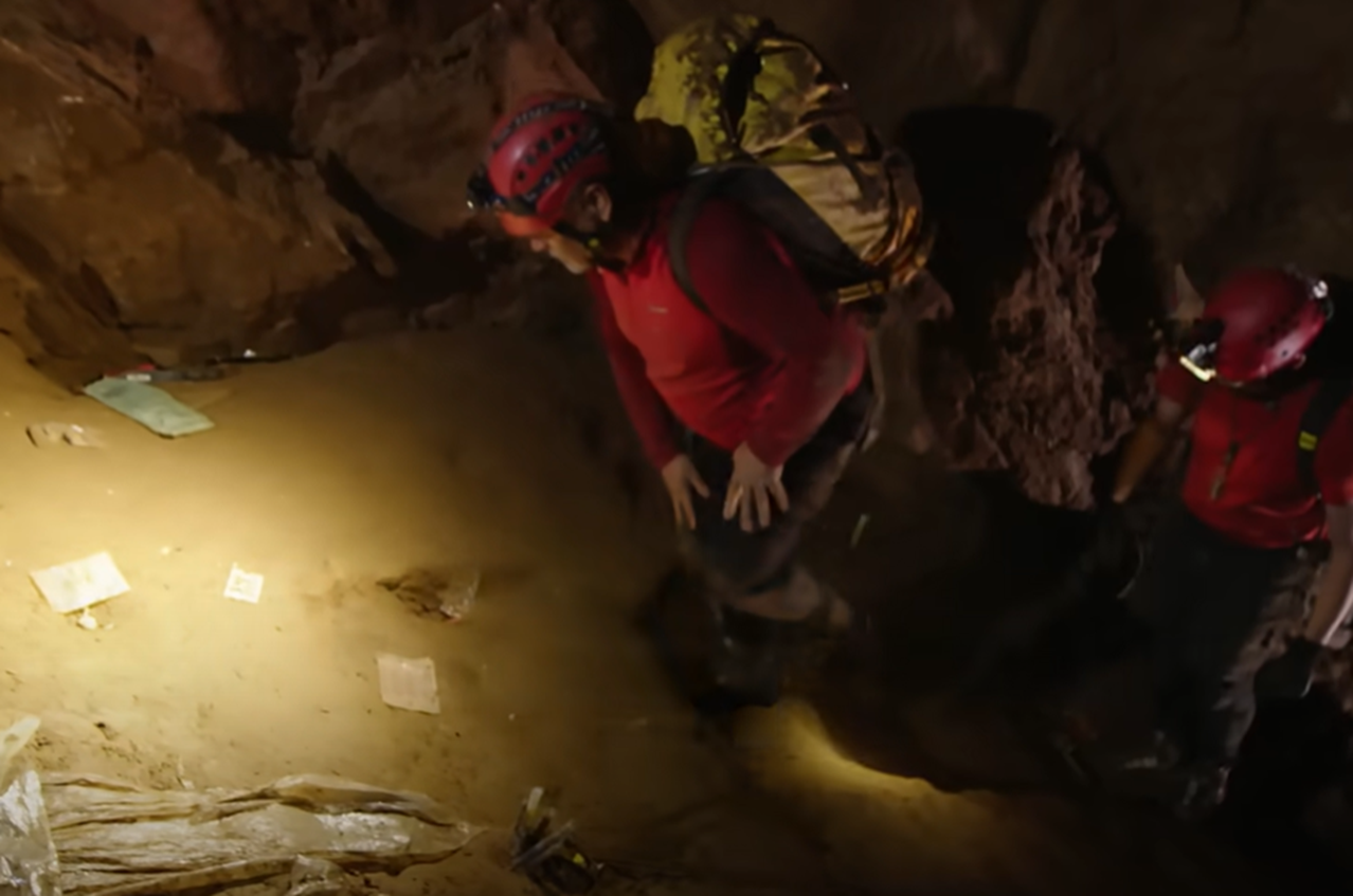 Screenshot of rescue divers in the cave - from Thai Cave Rescue (Drain the Oceans) 2019
