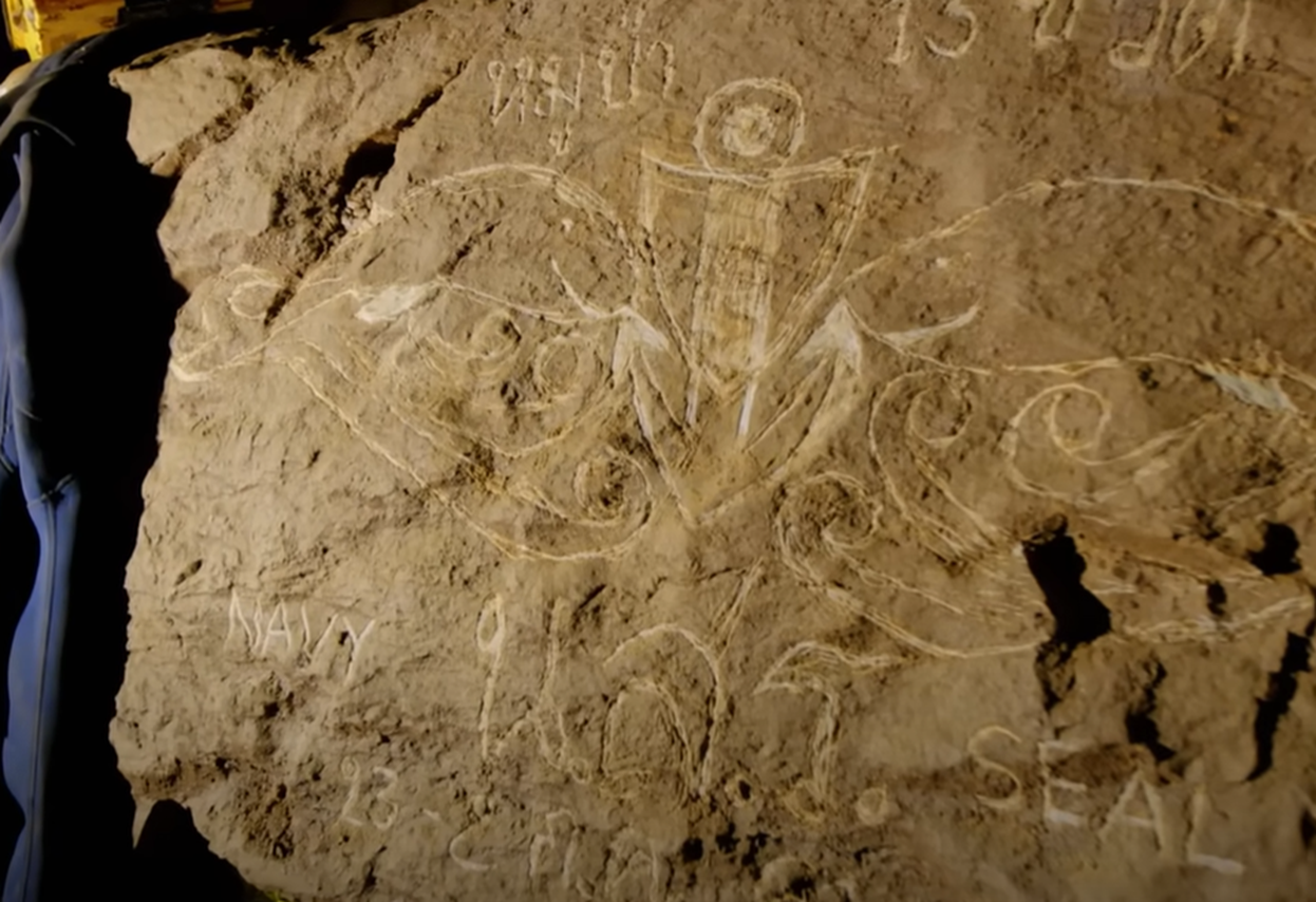 Screenshot of drawings inside the cave - from Thai Cave Rescue (Drain the Oceans) 2019