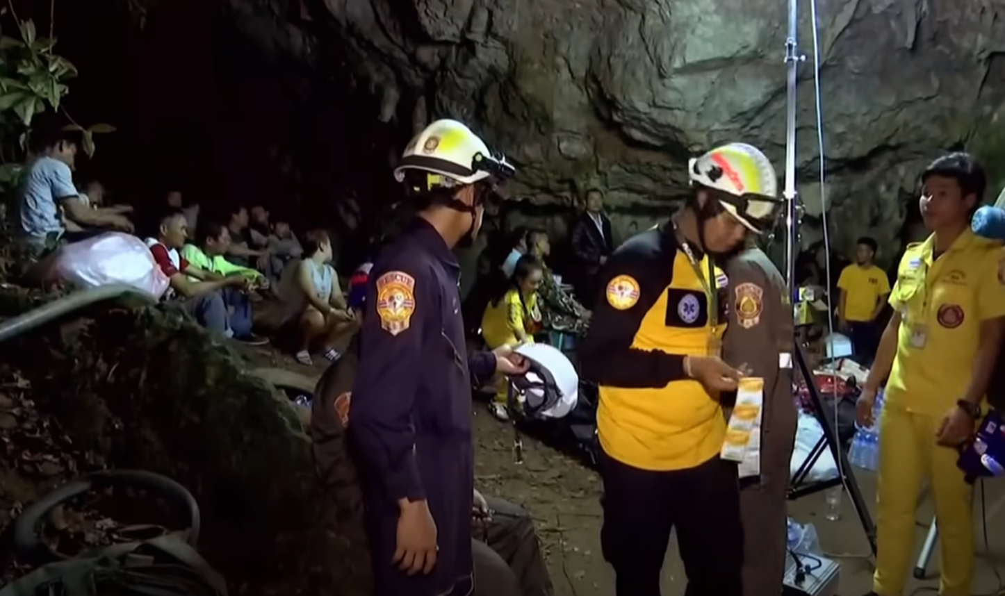 Screenshot of rescue divers in the cave - from Thai Cave Rescue (Drain the Oceans) 2019