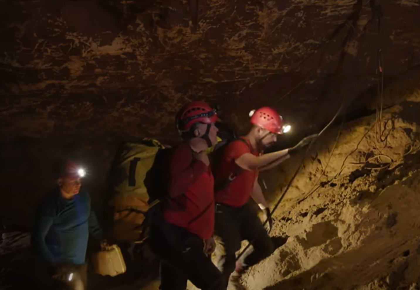 Screenshot of rescue divers in the cave - from Thai Cave Rescue (Drain the Oceans) 2019