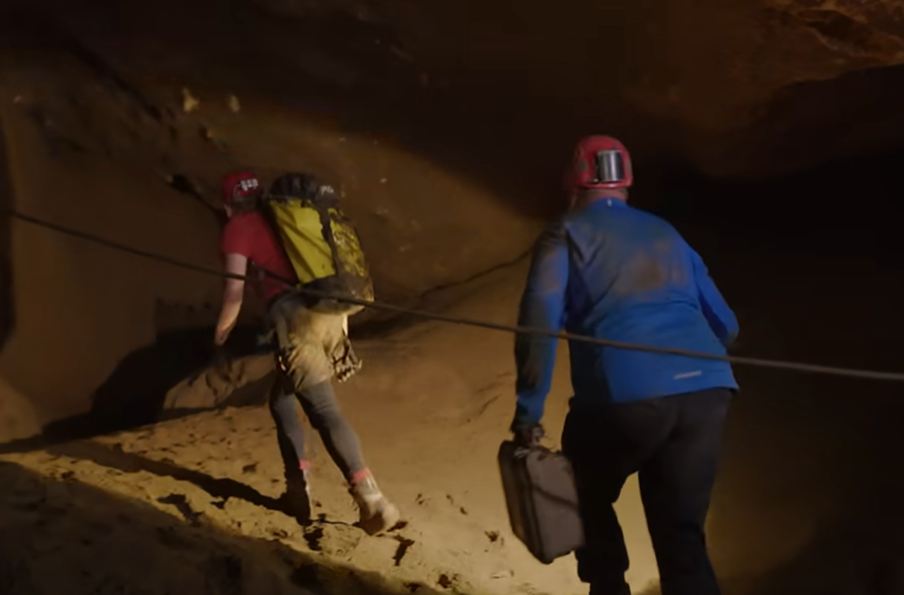Screenshot of rescue divers in the cave - from Thai Cave Rescue (Drain the Oceans) 2019