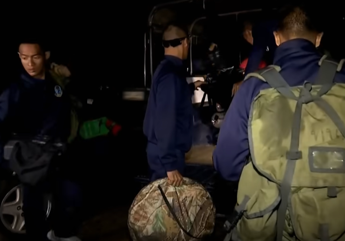 Screenshot of rescue divers in the cave - from Thai Cave Rescue (Drain the Oceans) 2019