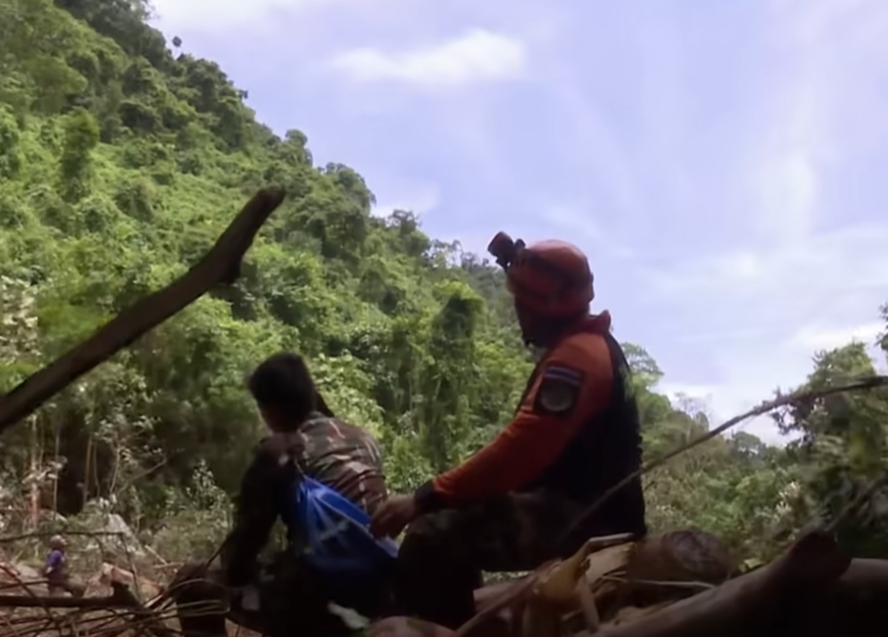 Screenshot of people outside the cave - from Thai Cave Rescue (Drain the Oceans) 2019