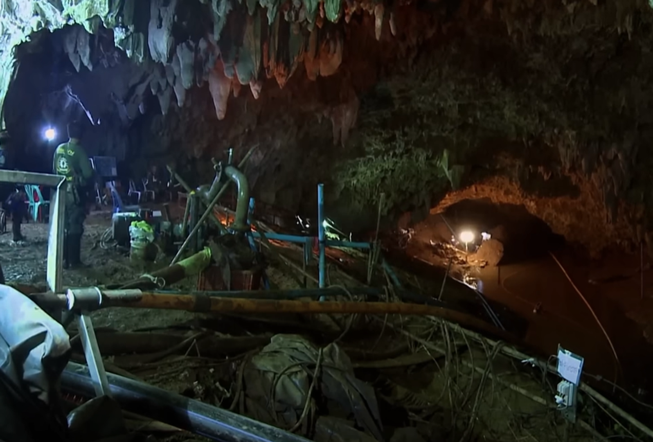 Screenshot of people outside the cave - from Thai Cave Rescue (Drain the Oceans) 2019