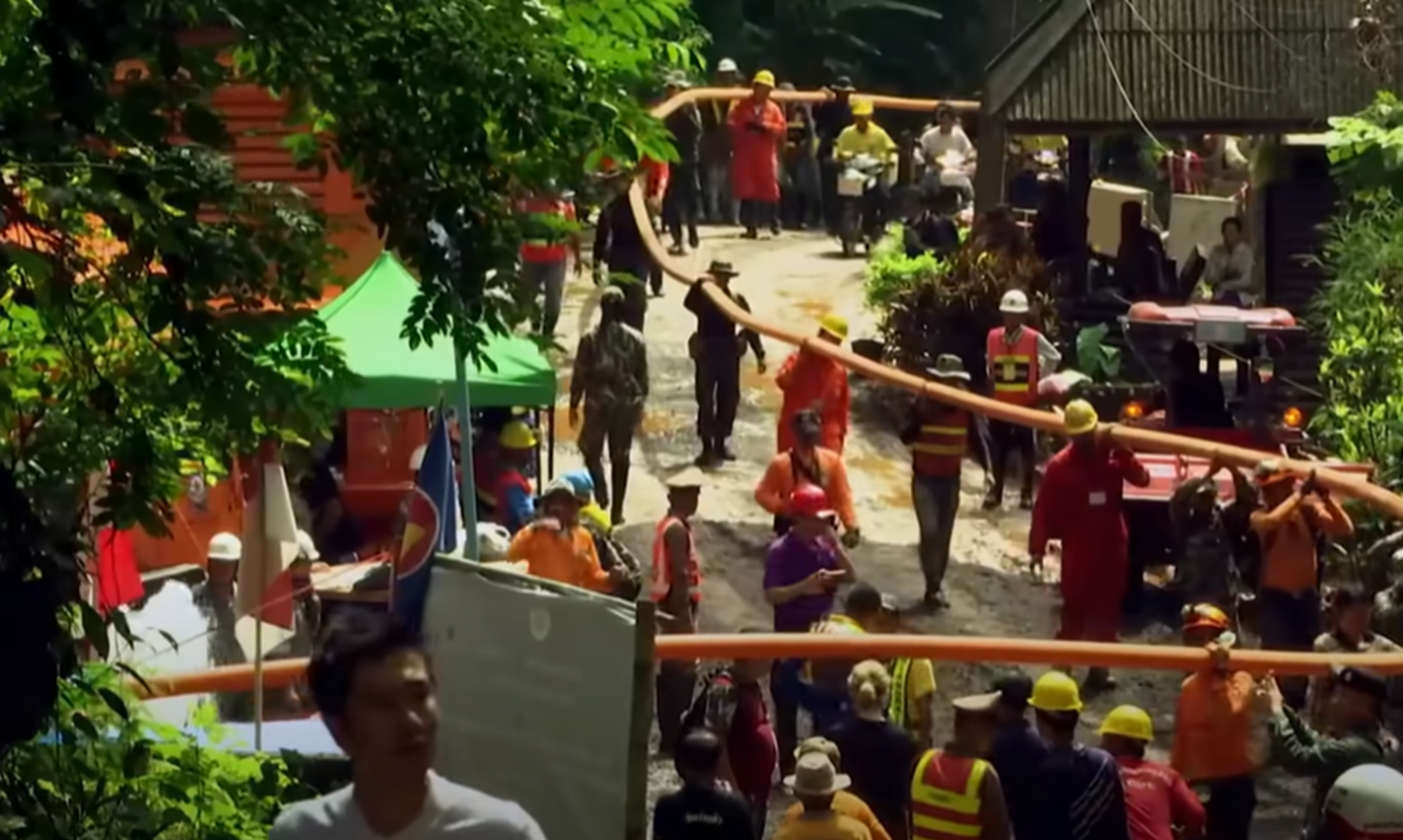 Screenshot of people outside the cave - from Thai Cave Rescue (Drain the Oceans) 2019