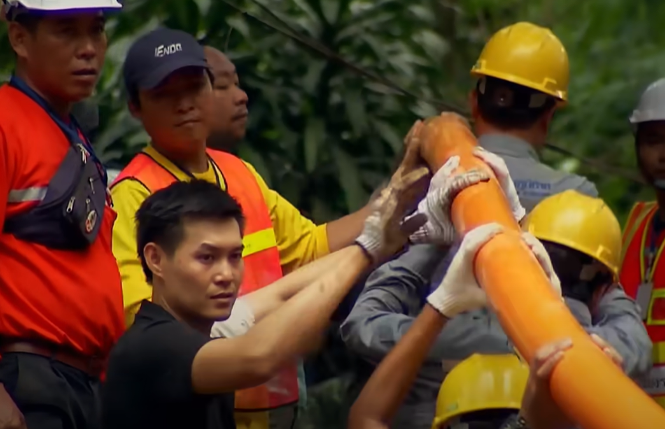Screenshot of people outside the cave - from Thai Cave Rescue (Drain the Oceans) 2019