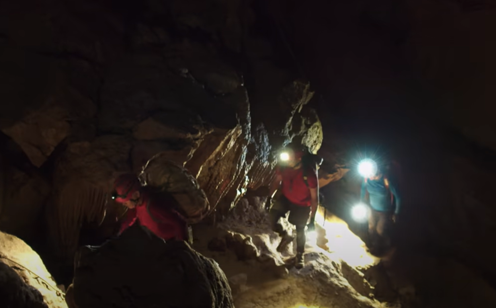 Screenshot of rescue divers in the cave - from Thai Cave Rescue (Drain the Oceans) 2019
