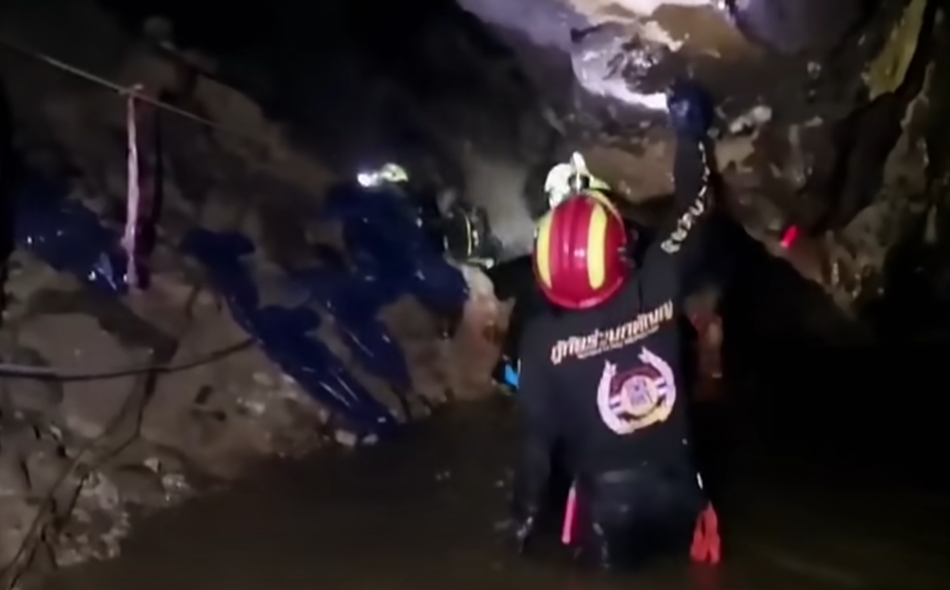 Screenshot of people in the cave - from Thai Cave Rescue (Drain the Oceans) 2019