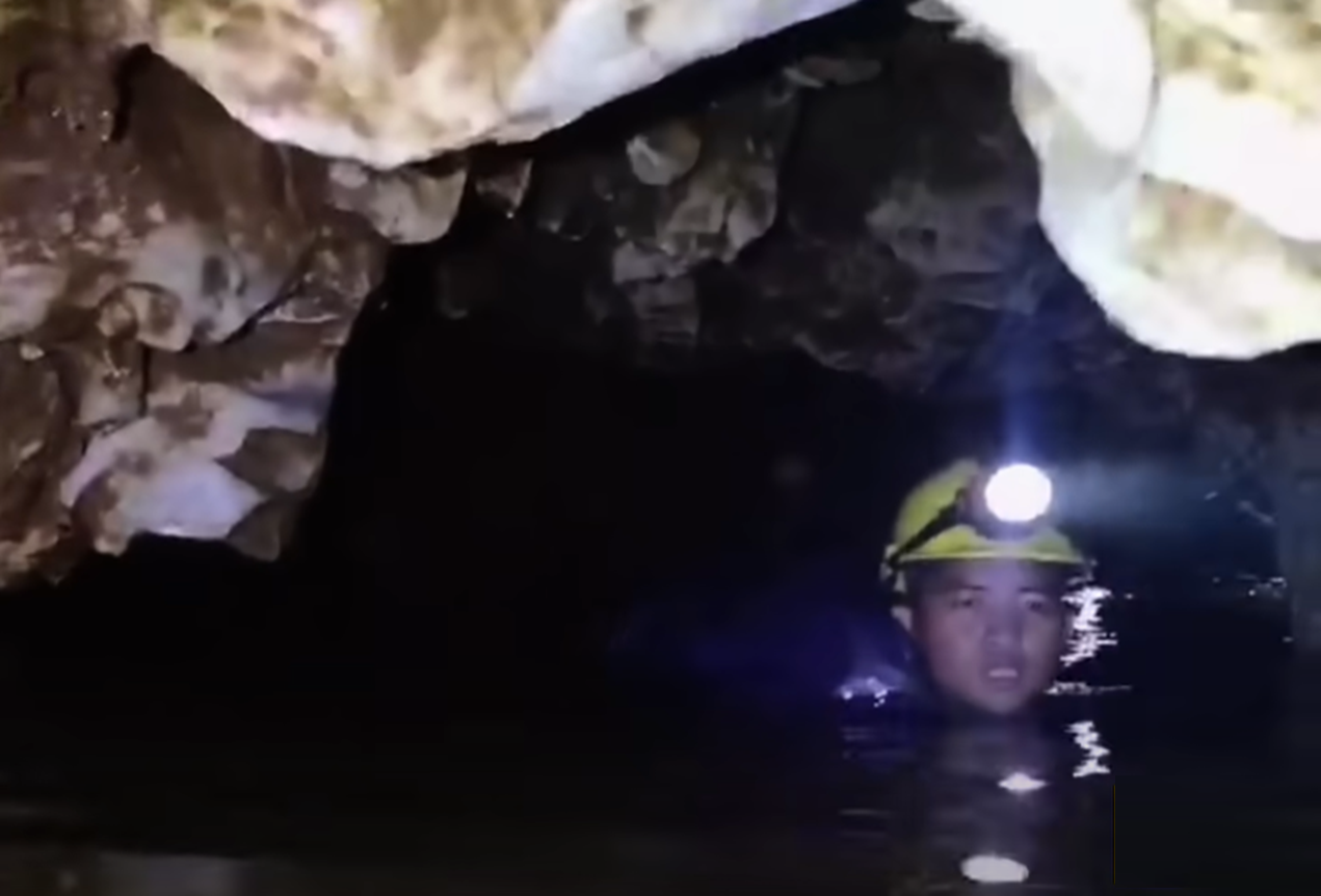 Screenshot of rescue divers in the cave - from Thai Cave Rescue (Drain the Oceans) 2019
