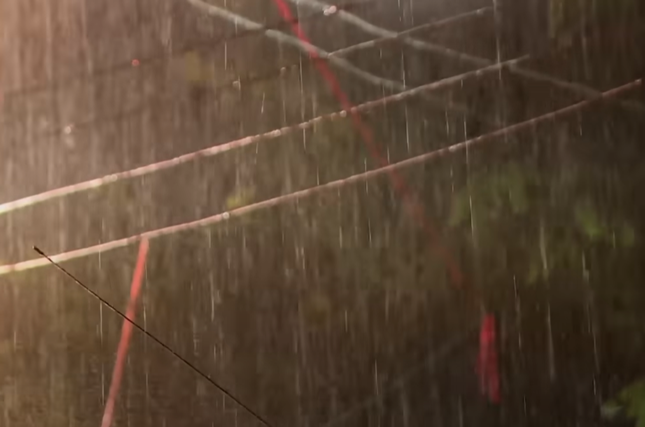 Screenshot of rain outside Tham Luang cave entrance - from Thai Cave Rescue (Drain the Oceans) 2019