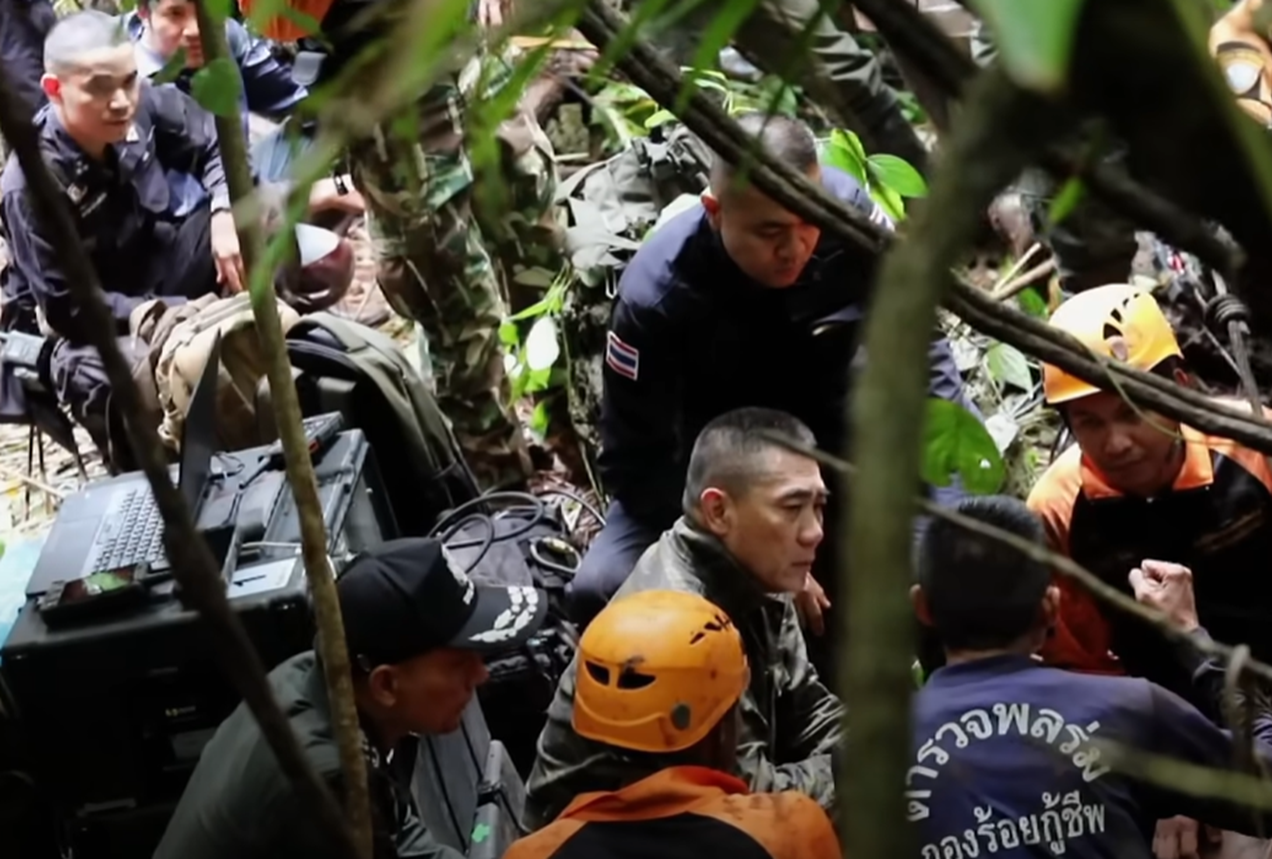 Screenshot of people outside the cave - from Thai Cave Rescue (Drain the Oceans) 2019