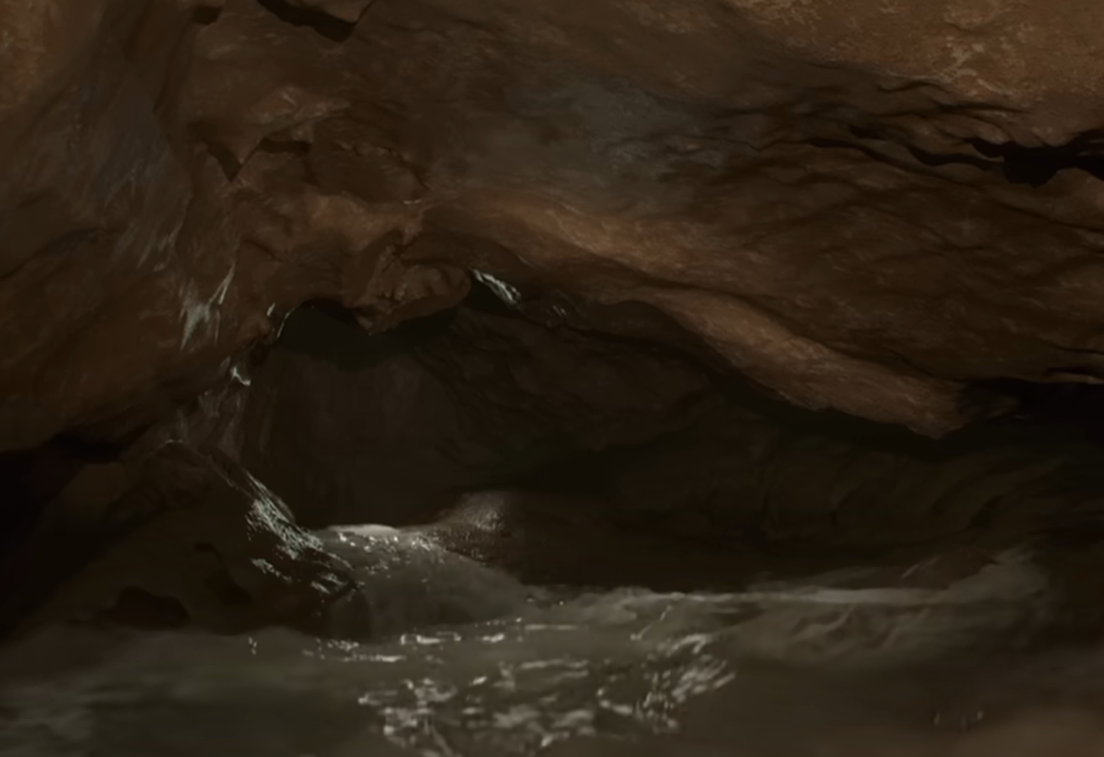 Screenshot of running water in the cave - from Thai Cave Rescue (Drain the Oceans) 2019