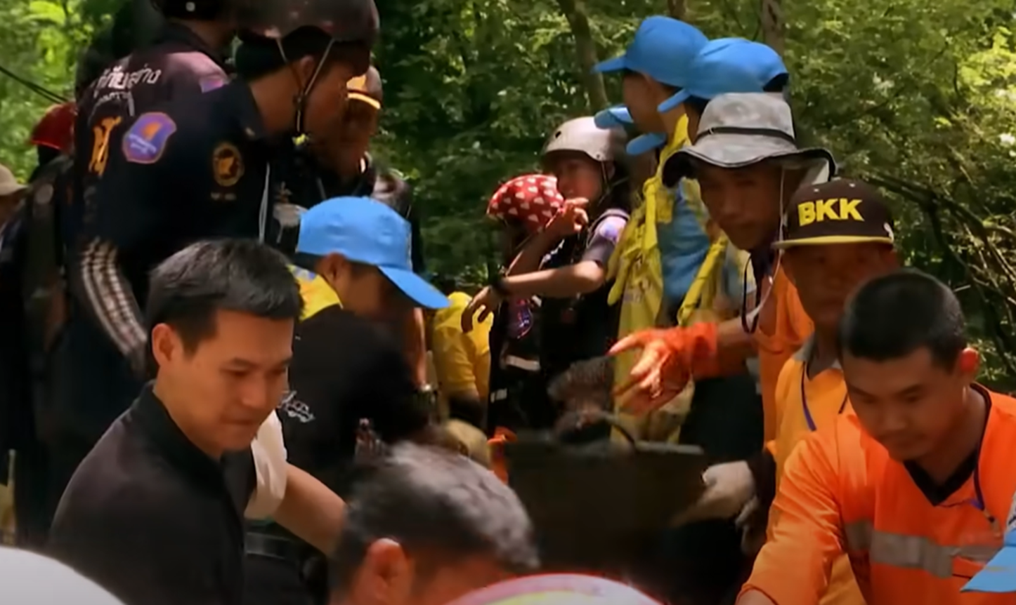 Screenshot of people outside the cave - from Thai Cave Rescue (Drain the Oceans) 2019