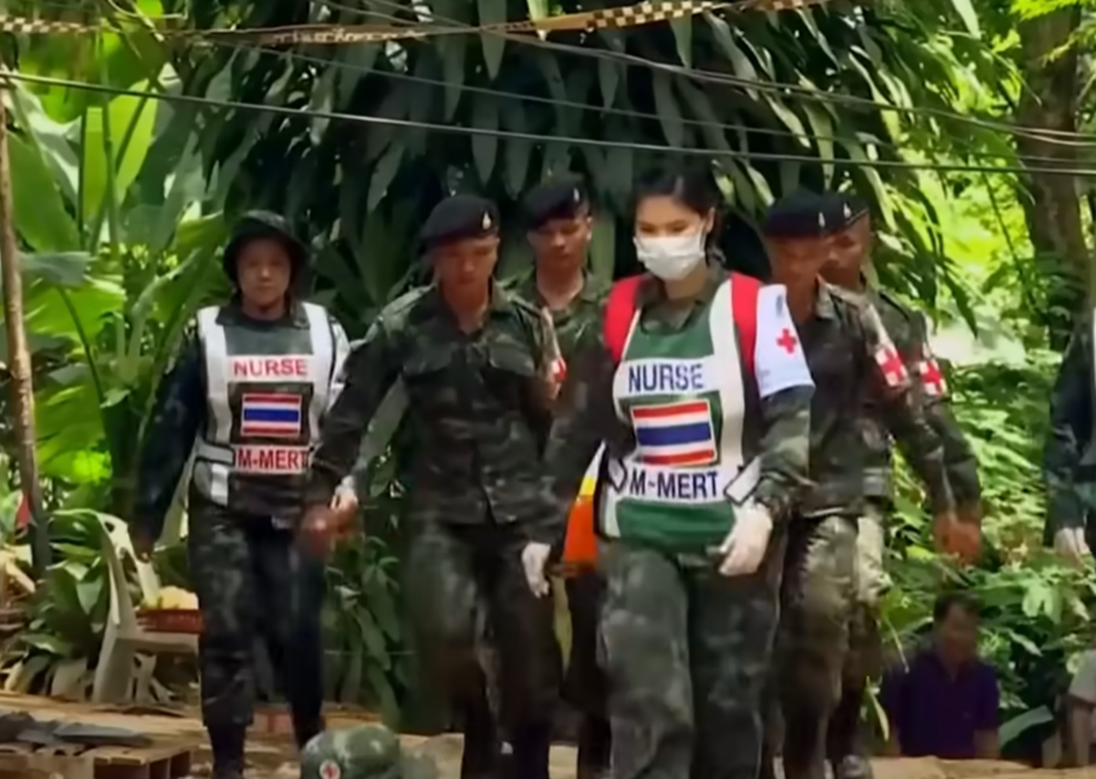 Screenshot of army people outside the cave - from Thai Cave Rescue (Drain the Oceans) 2019