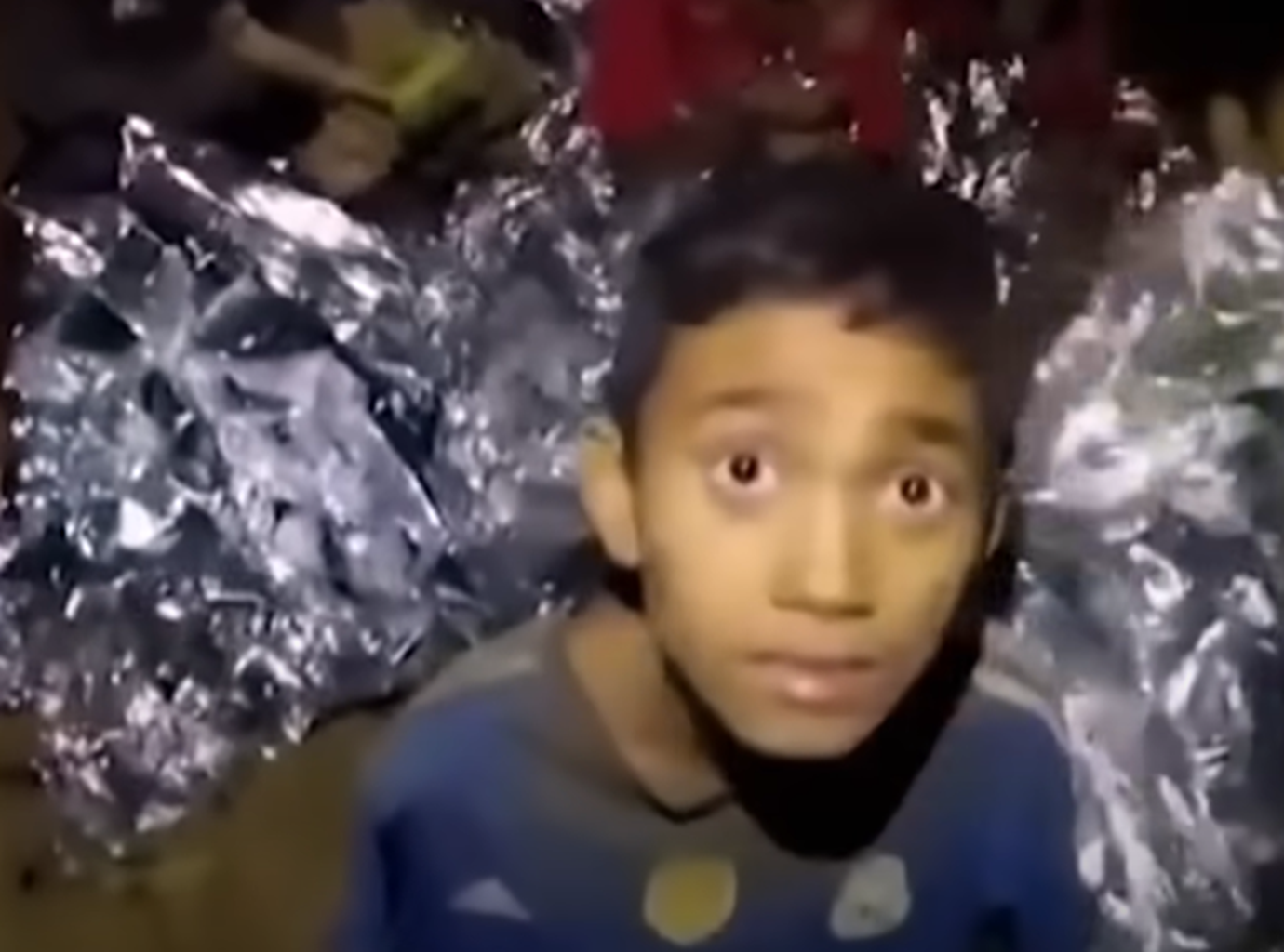 Screenshot of scared kids in the cave - from Thai Cave Rescue (Drain the Oceans) 2019