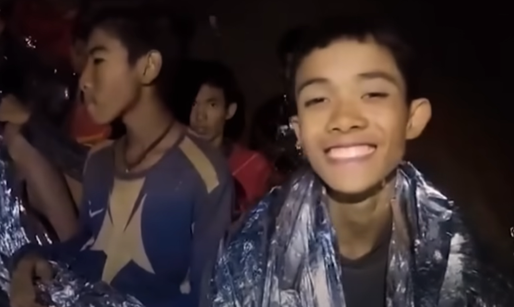 Screenshot of scared kids in the cave - from Thai Cave Rescue (Drain the Oceans) 2019