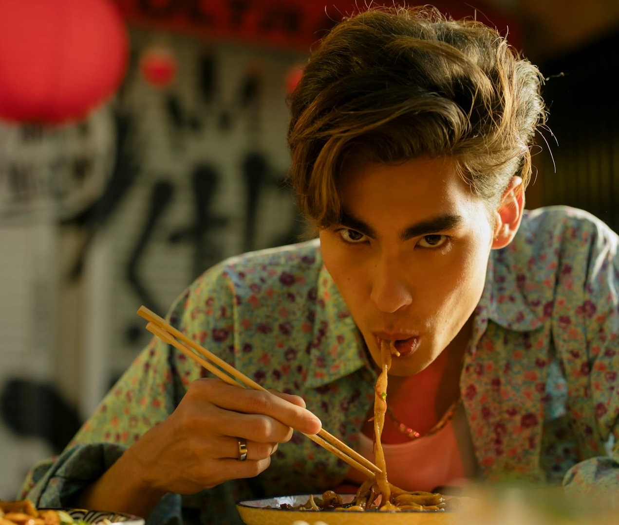 Man Eating Noodles