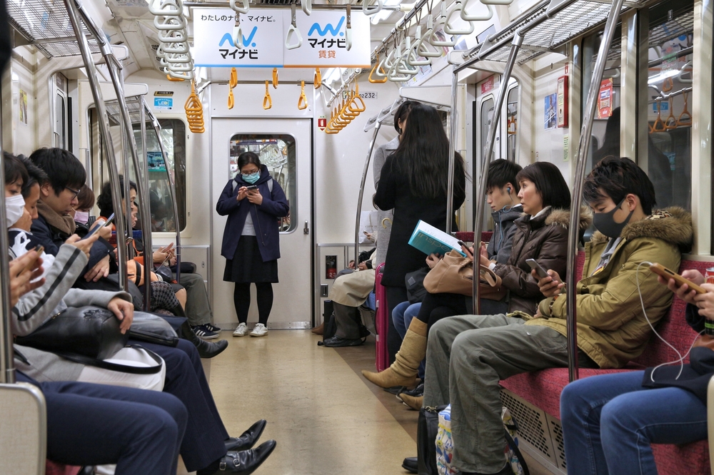 People ride Ginza Line train of Tokyo Metro. - 2016