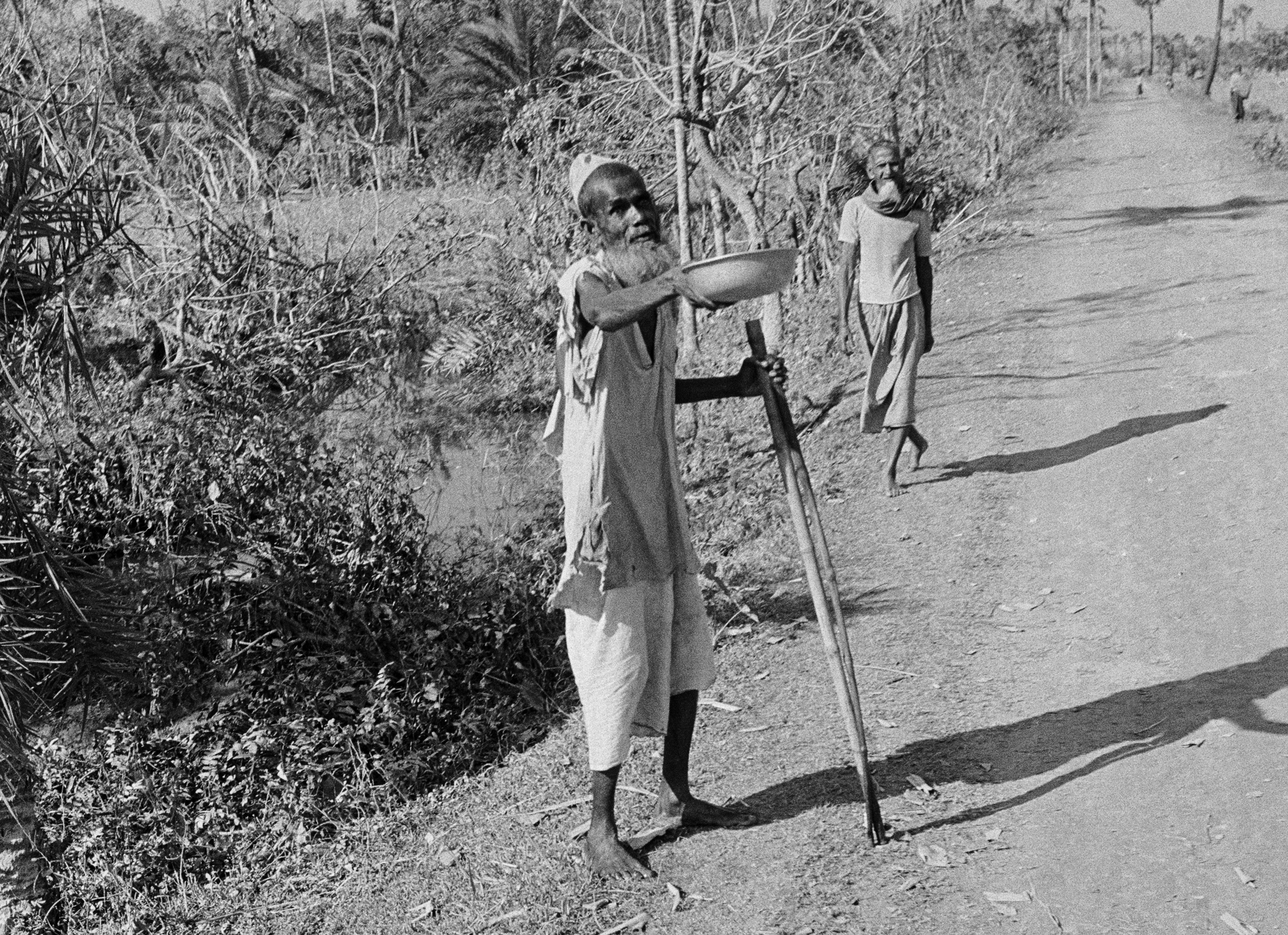 Elderly Man Begging for Food