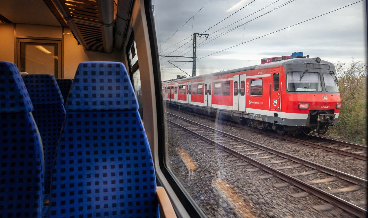 Empty seats in a german regional train in Cologne with speed blur on Koln S-Bahn suburban train