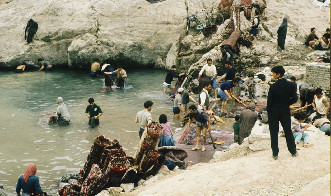 Iranians washing and rolling carpets in en:Cheshmeh-Ali (Shahr-e-Rey)