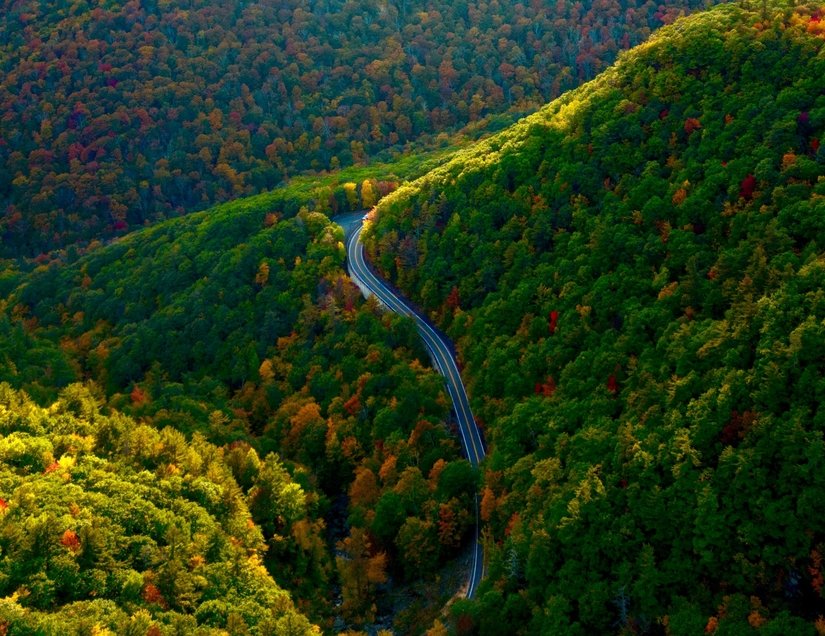 An aerial view of a winding road in the Catskill Mountains