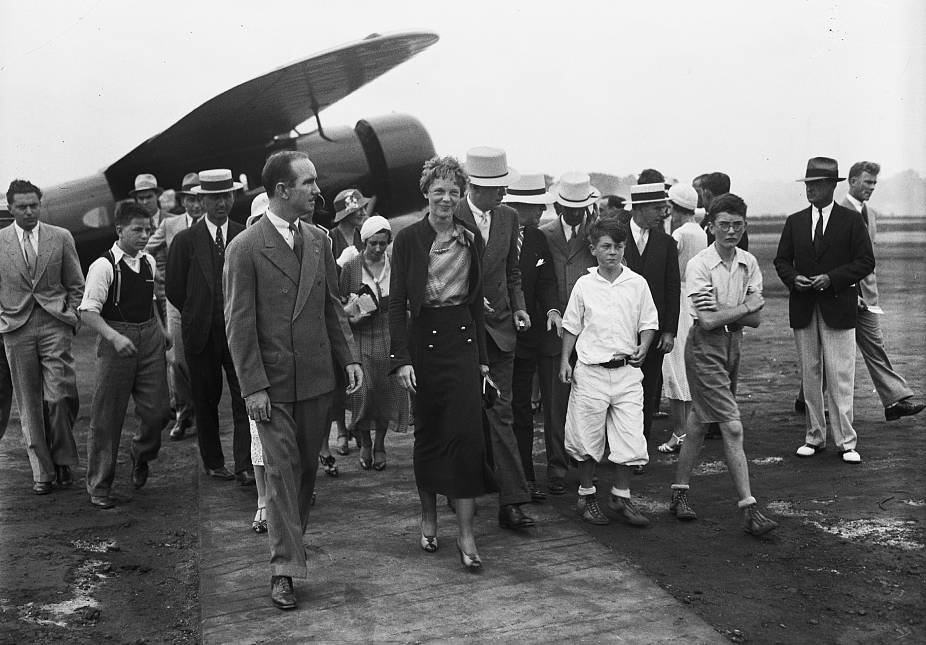 Amelia Earhart And a group walking