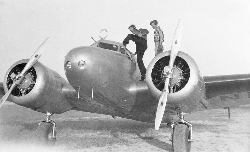 Amelia Earhart and Fred Noonan Entering Plane