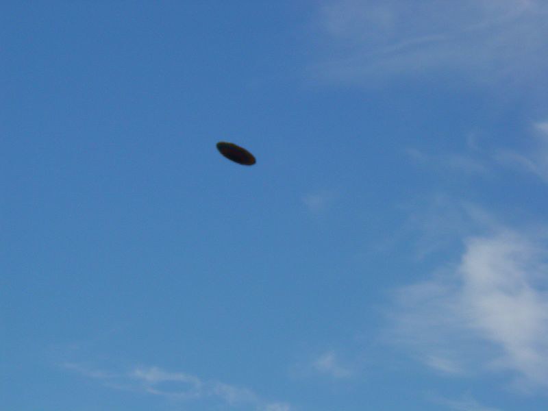 Non horizontal view of a supposed curvilinear centrally domed UFO