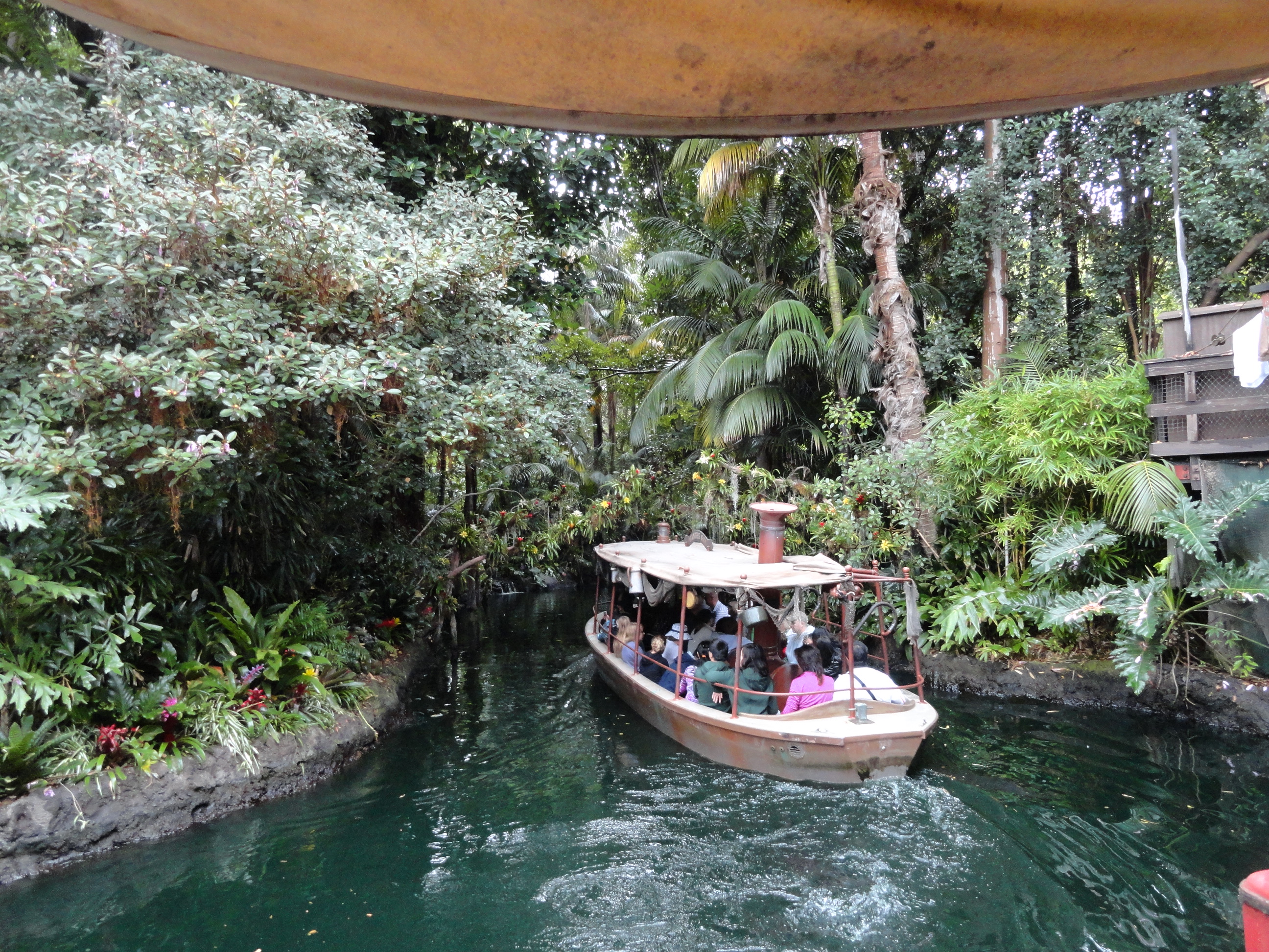 A boat cruising down the Jungle Cruise in Disneyland.
