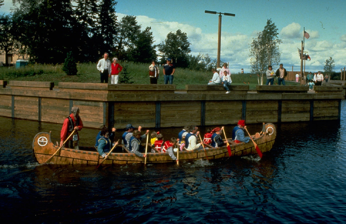 Birch bark canoes full of  people at Voyageurs National Park