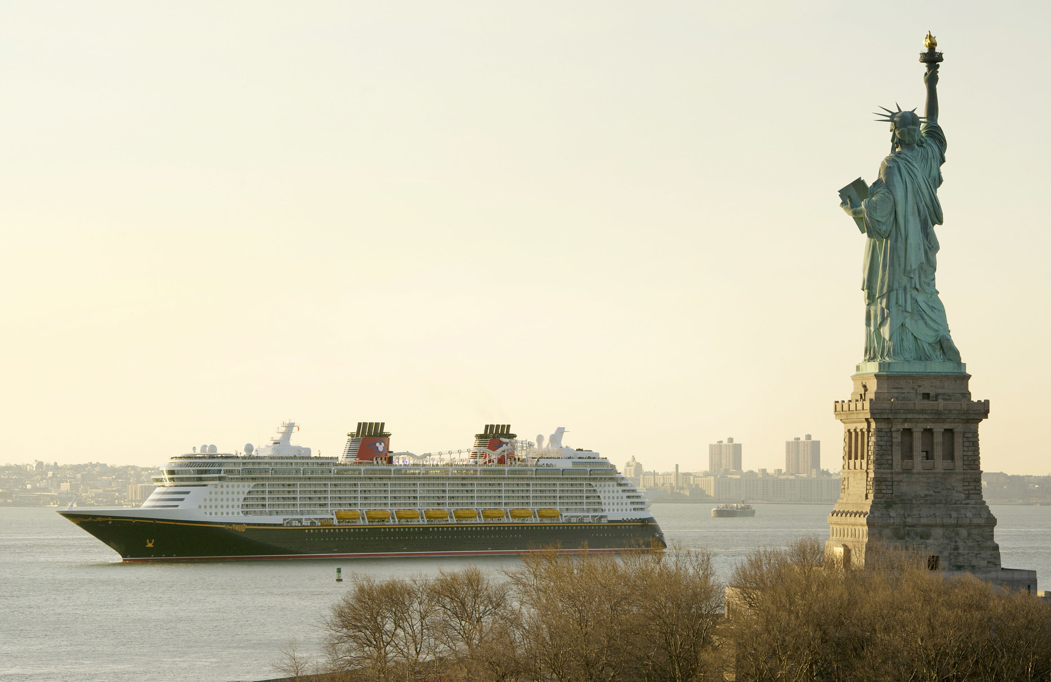 Ship of Disney Cruise Line, sails past the Statue of Liberty - 2012