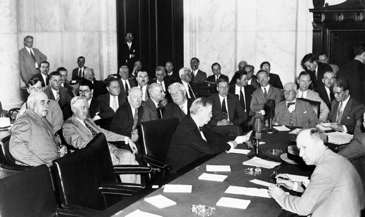The witnesses and Senators at the Senate Banking and Currency Committee hearing. May 26, 1933.