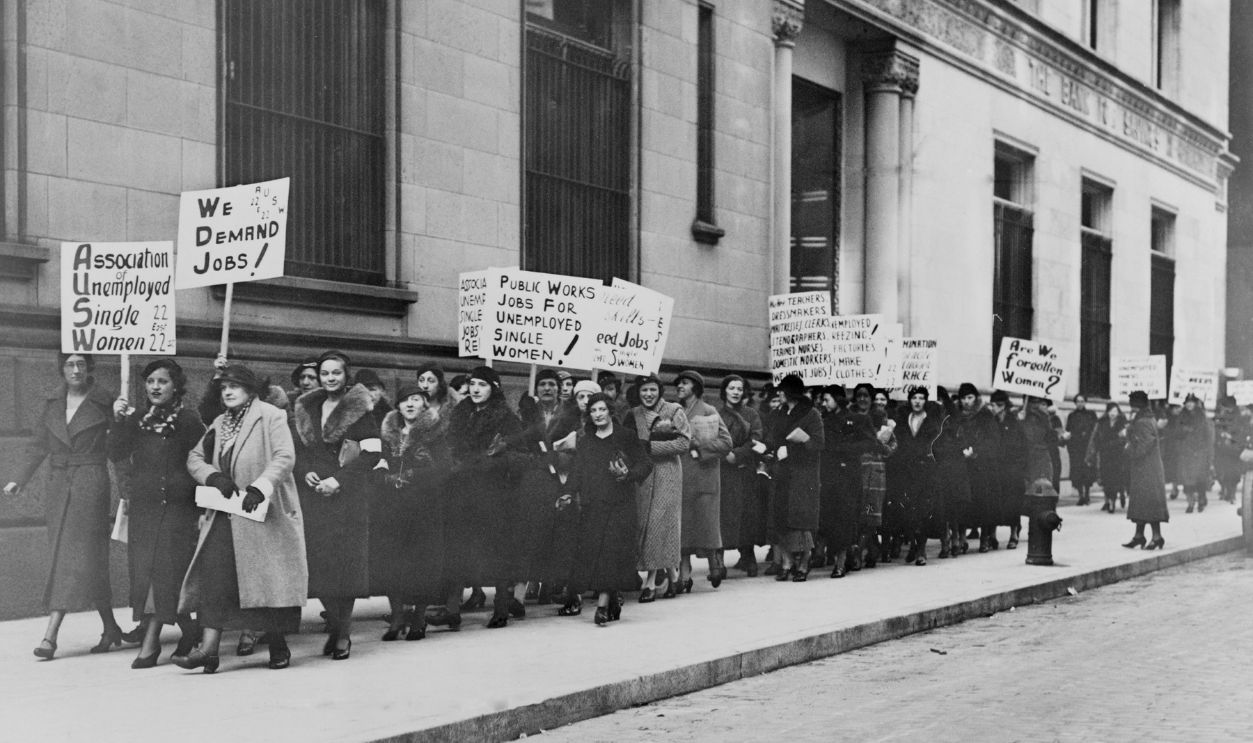Unemployed single women in New York demonstrate for public works jobs. Some placards read 