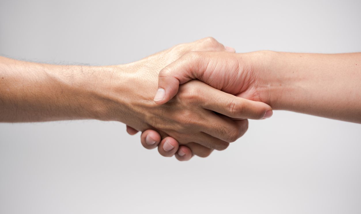 Close up two man shaking hand