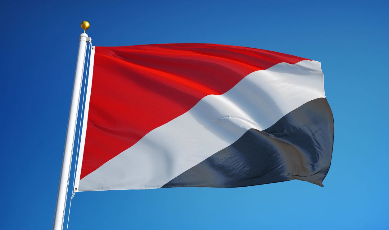 Sealand flag waving against clean blue sky