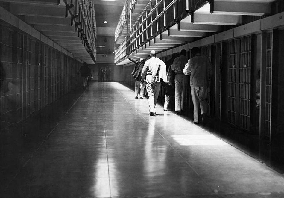 Alcatraz Inmates Walking Down the Cell Block