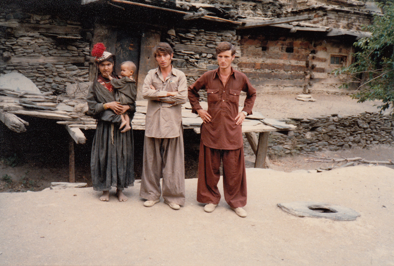 The man in the middle is Saifullah Jan